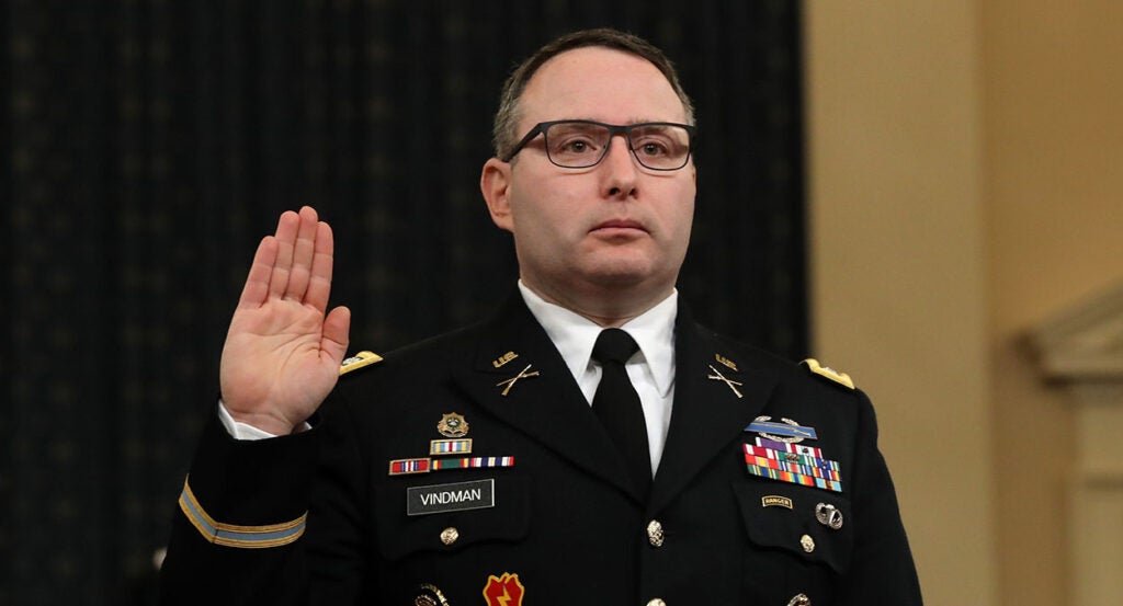 Alexander Vindman in his military uniform holds up his right hand to testify