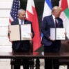 Donald Trump, Benjamin Netanyahu, and leaders from the United Arab Emirates and Bahrain outside the White House holding up signed copies of the Abraham Accords