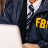 Handsome mature FBI agent using laptop in the office late at night. (Photo: https://www.gettyimages.com/search/photographer?(Photo: urbazon/ Getty Images)