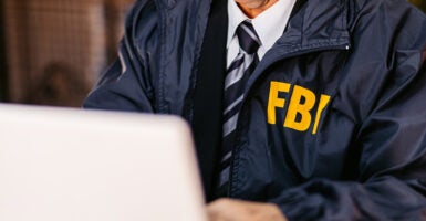 Handsome mature FBI agent using laptop in the office late at night. (Photo: https://www.gettyimages.com/search/photographer?(Photo: urbazon/ Getty Images)