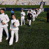 U.S. Naval Academy midshipmen walk in pairs into the Navy-Marine Corps Memorial Stadium for their graduation ceremony at the academy on May 24, 2024 in Annapolis, Maryland. (Chip Somodevilla/Getty Images)