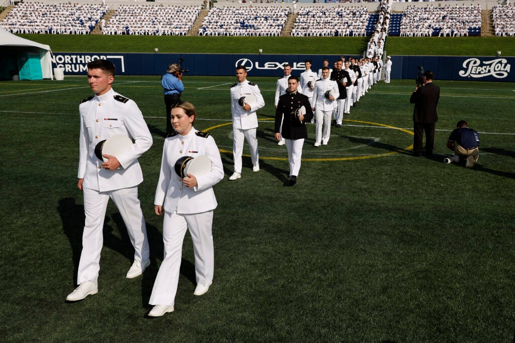 U.S. Naval Academy midshipmen walk in pairs into the Navy-Marine Corps Memorial Stadium for their graduation ceremony at the academy on May 24, 2024 in Annapolis, Maryland. (Chip Somodevilla/Getty Images)