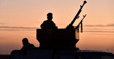 Popular Mobilisation Forces patrols an area of the the Baaj desert in Iraq's northern Nineveh province, near the Syrian border, during a security operation in search of reported remnants of the Islamic State (IS) jihadist group on September 15, 2024.