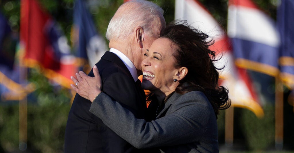 WASHINGTON, DC - NOVEMBER 15: U.S. Vice President Kamala Harris hugs President Joe Biden as he prepares to deliver remarks during the signing ceremony for the Infrastructure Investment and Jobs Act on the South Lawn at the White House on November 15, 2021 in Washington, DC. The $1.2 trillion package will provide funds for public infrastructure projects including improvements to the country’s transportation networks, increasing rural broadband access, and projects to modernizing water and energy systems. (Photo by Alex Wong/Getty Images)