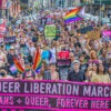 LGBTQ activists march in New York City with rainbow flags