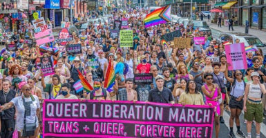 LGBTQ activists march in New York City with rainbow flags