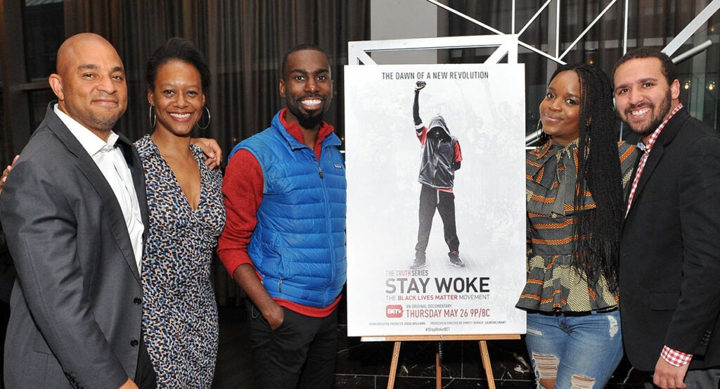 Producers and actors with the poster for "Stay Woke: The Black Lives Matter Movement"