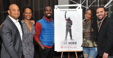 Producers and actors with the poster for 