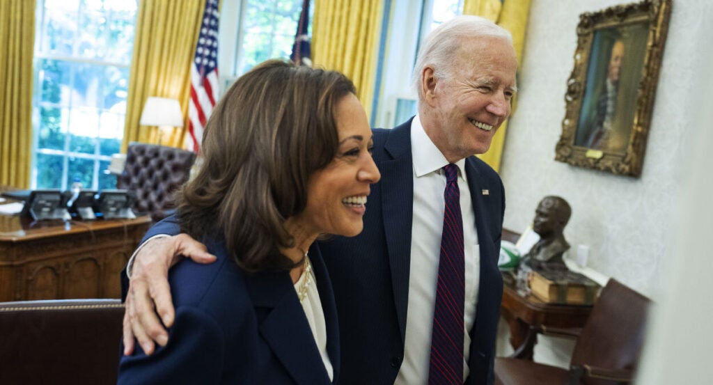 Kamala Harris and Joe Biden smile in the Oval Office