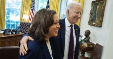 Kamala Harris and Joe Biden smile in the Oval Office