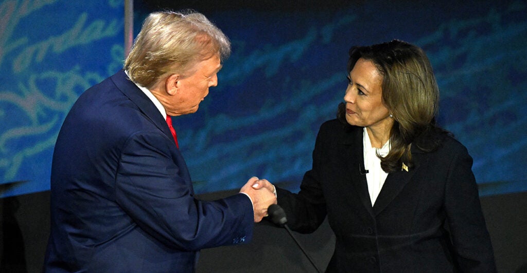 TOPSHOT - US Vice President and Democratic presidential candidate Kamala Harris (R) shakes hands with former US President and Republican presidential candidate Donald Trump during a presidential debate at the National Constitution Center in Philadelphia, Pennsylvania, on September 10, 2024. (Photo by SAUL LOEB / AFP) (Photo by SAUL LOEB/AFP via Getty Images)