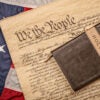 The Bible lying on top of the Constitution, which is lying on top of the American flag.