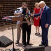 Donald Trump next to the border fence in Arizona with the mother of a young girl who was killed by illegal aliens