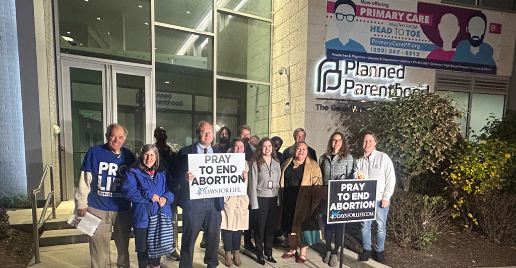  Local organizers and participants of the 40 Days for Life campaign gather at a closing rally outside the Planned Parenthood - Carol Whitehill Moses Center. (Photo by Ann Moreno) 