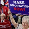 MILWAUKEE, WISCONSIN - JULY 17: People hold signs that read "Mass Deportation Now!" on the third day of the Republican National Convention at the Fiserv Forum on July 17, 2024 in Milwaukee, Wisconsin. Delegates, politicians, and the Republican faithful are in Milwaukee for the annual convention, concluding with former President Donald Trump accepting his party's presidential nomination. The RNC takes place from July 15-18. (Photo by Alex Wong/Getty Images)