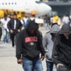 GUATEMALA CITY, GUATEMALA - FEBRUARY 09: Guatemalan immigrants deported from the United States arrive on a ICE deportation flight on February 9, 2017 in Guatemala City, Guatemala. The charter jet, carrying 135 deportees, arrived from Texas, where U.S. border agents catch the largest number illigal immigrants crossing into the United States, many of them from Central America. U.S. President Donald Trump pledged to vastly increase the number of deportations. (Photo by John Moore/Getty Images)