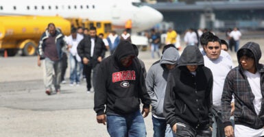 GUATEMALA CITY, GUATEMALA - FEBRUARY 09: Guatemalan immigrants deported from the United States arrive on a ICE deportation flight on February 9, 2017 in Guatemala City, Guatemala. The charter jet, carrying 135 deportees, arrived from Texas, where U.S. border agents catch the largest number illigal immigrants crossing into the United States, many of them from Central America. U.S. President Donald Trump pledged to vastly increase the number of deportations. (Photo by John Moore/Getty Images)