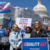 Sarah McBride in front of trans flag