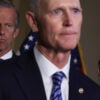 U.S. Sen. Rick Scott (R-FL) stands with Senate Minority Leader Sen. Mitch McConnell (R-KY) and Senate Minority Whip Sen. John Thune (R-SD).