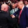 Podcaster Joe Rogan shakes the hand of President-elect Donald Trump at a UFC fight.