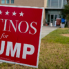 A Trump campaign sign targeting Hispanics greets voters on Election Day at a polling place in Houston. (Yi-Chin Lee/Houston Chronicle via Getty Images)