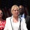 Pam Bondi speaks in white