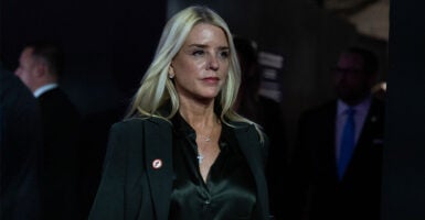 Former Florida state Attorney General Pam Bondi depicted with sci-fi-style glowing eyes as the Left's worst nightmare