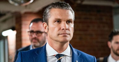 Pete Hegseth in a blue pin-stripe suit