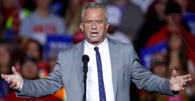 Robert F. Kennedy Jr. in a grey suit with a blue tie