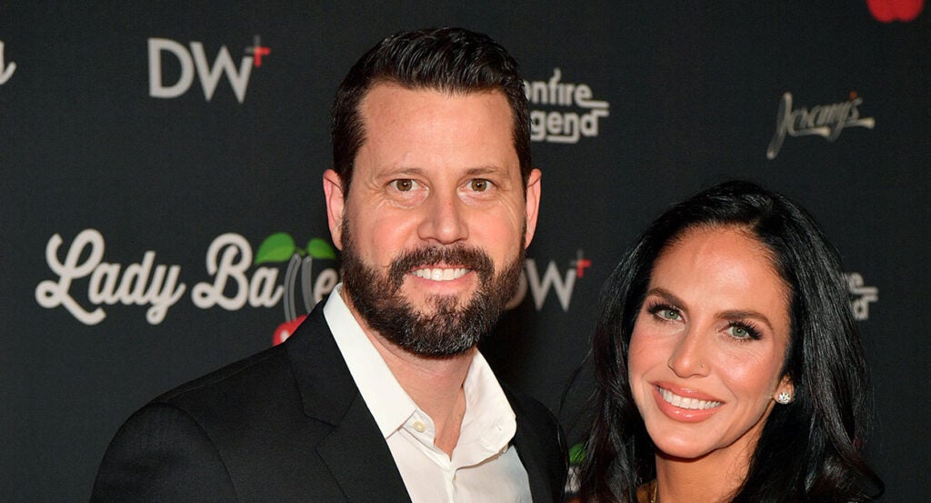 Seth Dillon in a suit with his wife