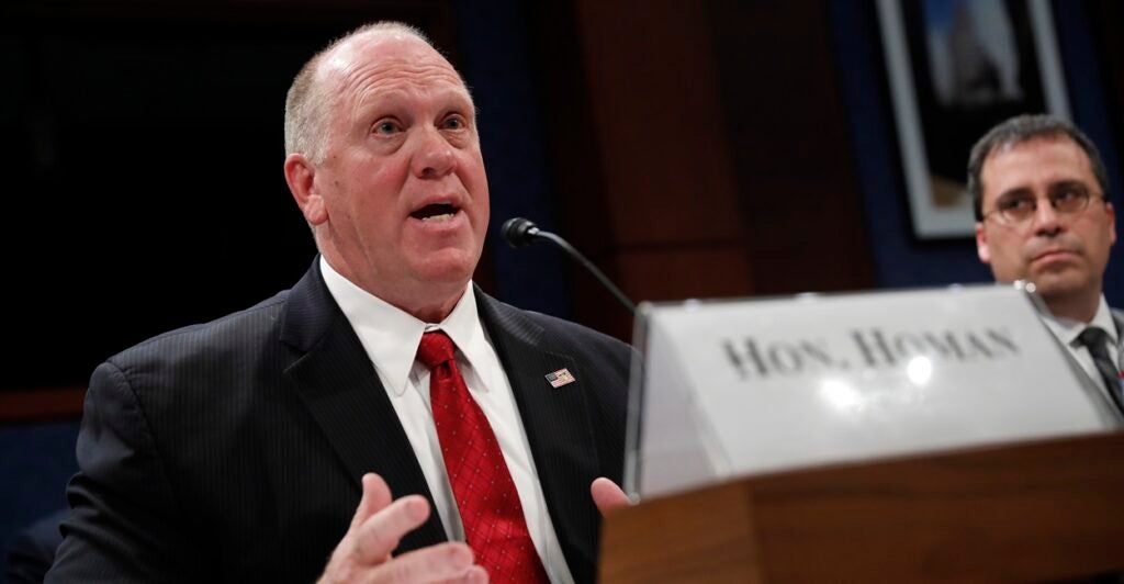 Thomas Homan, President Donald Trump's selection to be the border czar, testifies at a Congressional hearing wearing a red tie.