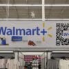 A large Walmart banner hangs in a supercenter.