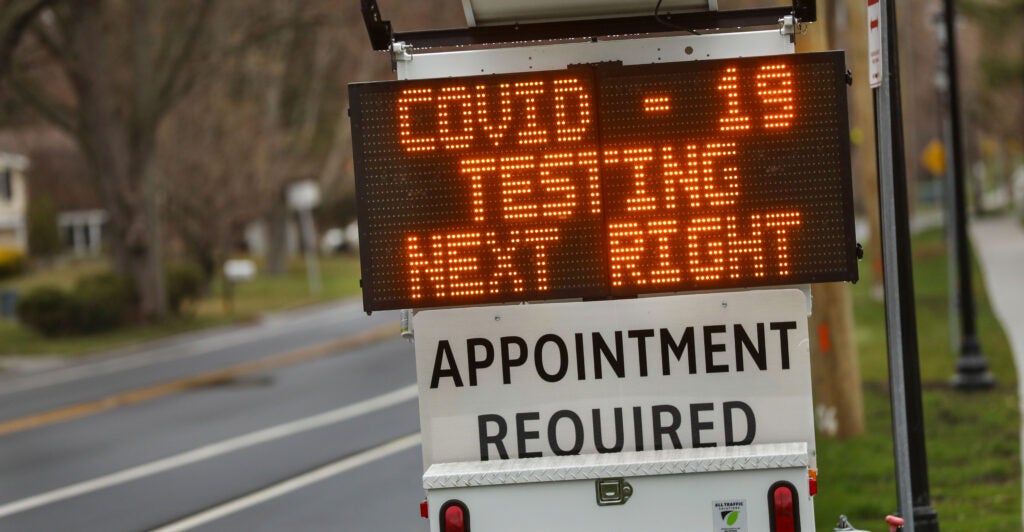 A digital sign on Long Island, New York, directs patients to a drive-through coronavirus test site on March 28, 2020.