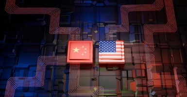 U.S. and Chinese flags amid a digitally generated image representing high technology