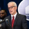 Denis McDonough, secretary of Veterans Affairs, in a white shirt and red tie