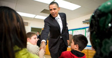 Then-President Barack Obama visits with sixth-graders at an elementary school in Falls Church, Virginia, on Jan. 19, 2010.