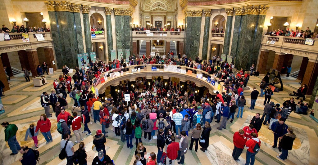 An aerial view of the Wisconsin state Capitol Rotunda filled with demonstrators in February 2011