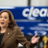 Vice President Kamala Harris in a brown pantsuit speaking at a clean energy event