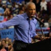 Former President Barack Obama, in a blue shirt but no jacket or tie, addresses a campaign rally for Vice President Kamala Harris on Oct. 10 in Pittsburgh.