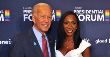 Then-presidential candidate Joe Biden and black transgender actor Angelica Ross pose for photos at an LGBTQ event in September 2019.