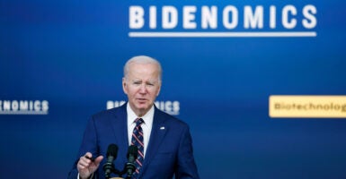 President Joe Biden touts Bidenomics at an event in the Eisenhower Executive Office Building .