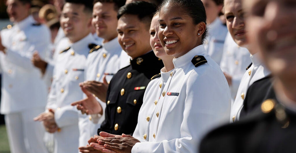 Midshipmen at the U.S. Naval Academy applaud during a May 24 graduation ceremony in Annapolis, Maryland.