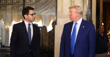 Azoria executive James Fishback is pictured talking with President-elect Donald Trump on Dec. 5 at the president-elect's Mar-a-Lago estate in Palm Beach, Florida. (Azoria)