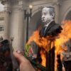 Anti-Israel protesters burn an effigy of Israeli Prime Minister Benjamin Netanyahu.