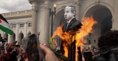 Anti-Israel protesters burn an effigy of Israeli Prime Minister Benjamin Netanyahu.