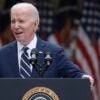 President Joe Biden stands behind a podium at a press conference.