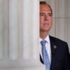 Rep. Adam Schiff, partially obscured by a congressional building's column