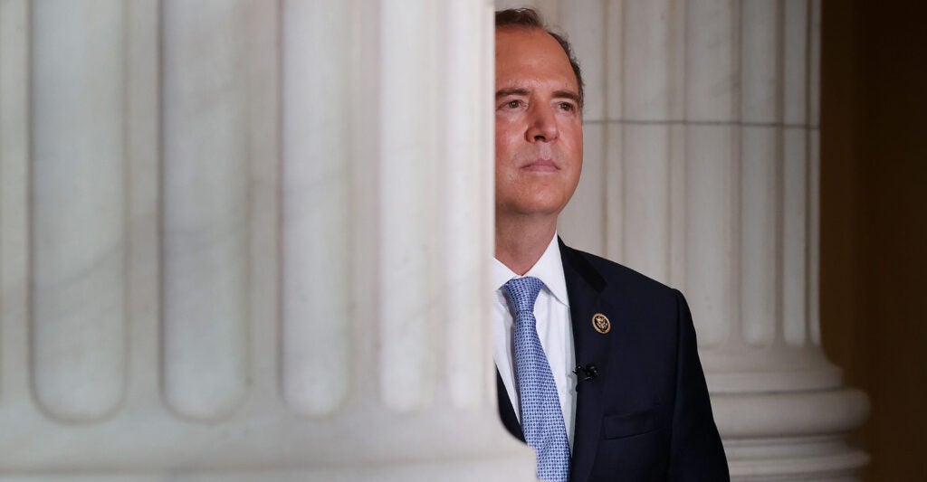 Rep. Adam Schiff, partially obscured by a congressional building's column