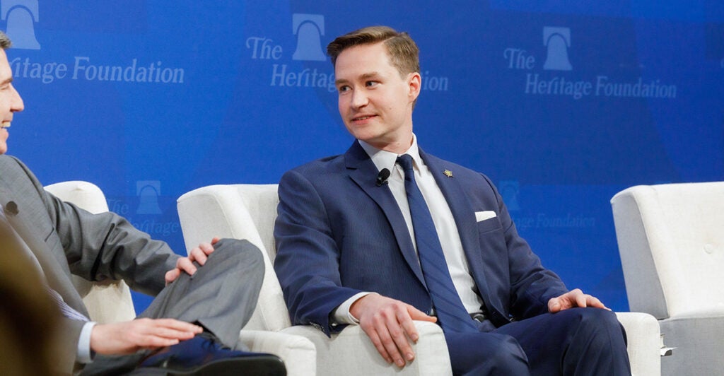 Ohio Solicitor General T. Elliot Gaiser, in a navy blue suit, pictured on stage at The Heritage Foundation.