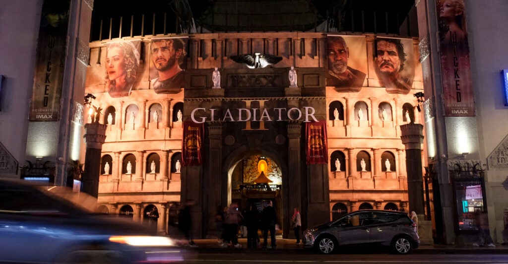 The front of the TCL Chinese Theatre in Hollywood at night, decorated to look like the Roman Colosseum.